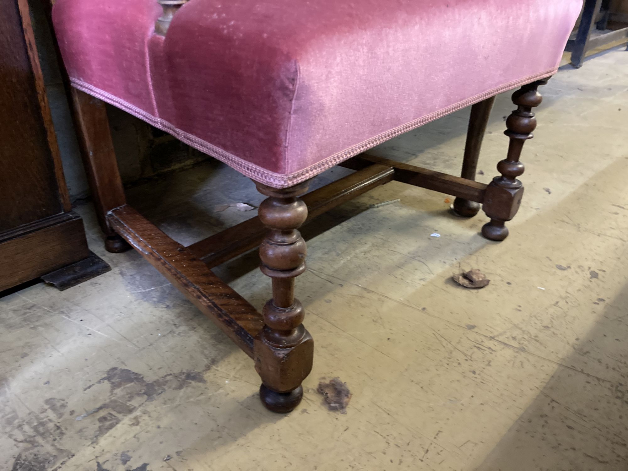 A walnut upholstered elbow chair, circa 1700